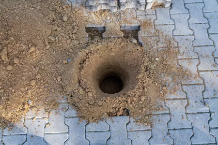 Gartenhaus Garagen Fundamente erstellen mit einem Minibagger und Erdbohrer