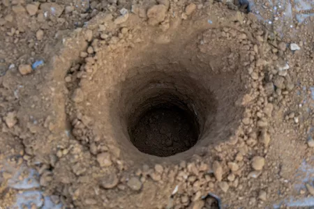 Gartenhaus Garagen Fundamente erstellen mit einem Minibagger und Erdbohrer